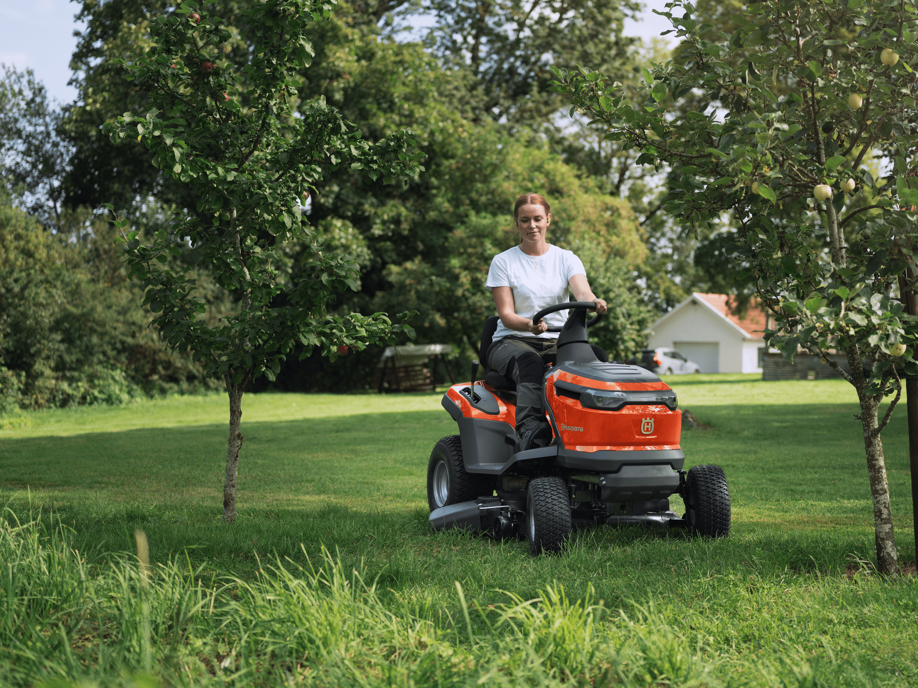 woman mowing lawn